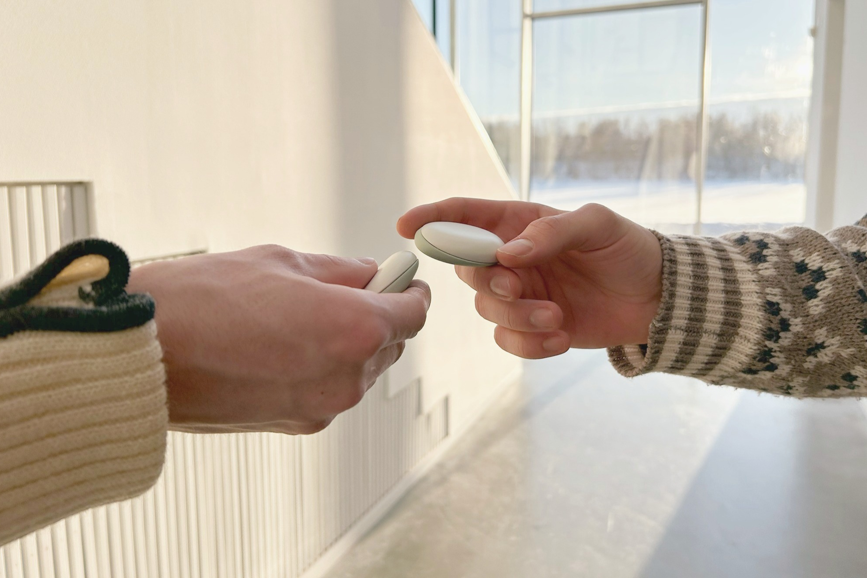 Adding friends to your network by holding recorders together.